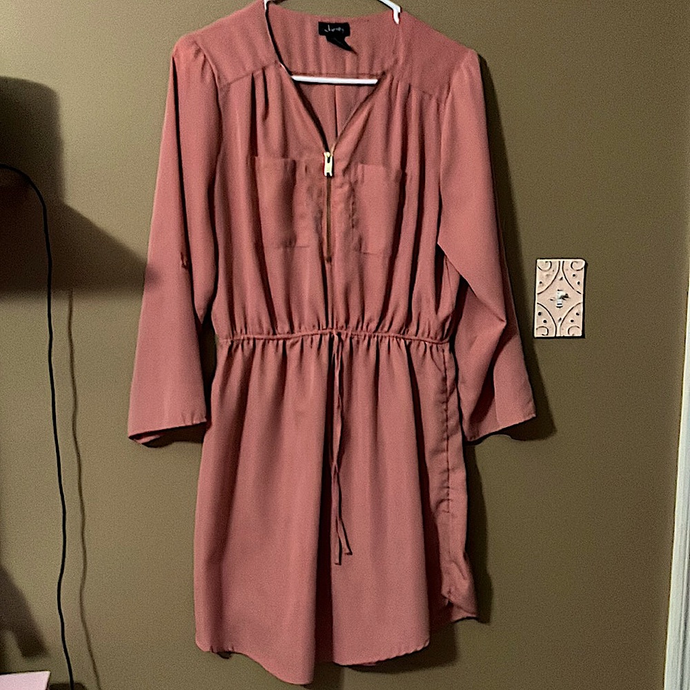 A rose colored eye catching dress.
